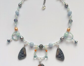 butterfly wing charm necklace with freshwater pearls, opalite, and jade beads