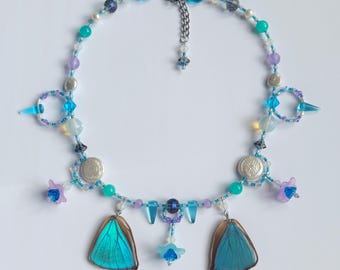 morpho butterfly wing charm necklace with freshwater pearls, opalite, jade, and crystals