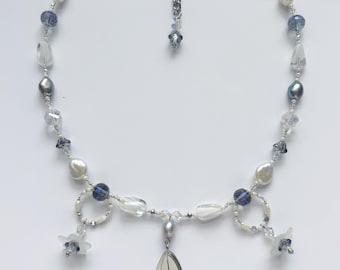 butterfly wing and flower charm necklace with freshwater pearls and stainless steel