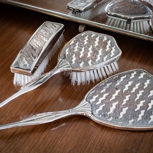 Vintage Delina ladies vanity/dressing table set, silver plated, with two brushes and mirror