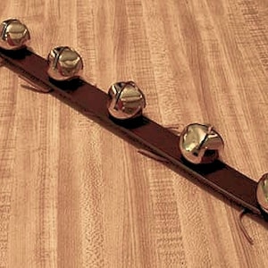 Handmade Leather Jingle Bell Strap_Christmas Door Decor.  Five brass-plated bells on leather strap 1 1/4" x 18" plus hanger