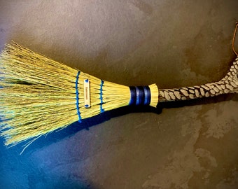 Traditional handmade broomcorn brush with Yakisugi technique handle and ocean blue milk paint. Sustainable crafts and eco friendly.