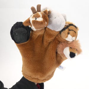 May include: A brown plush hand puppet with five finger puppets attached. The finger puppets are a giraffe, a hippopotamus, a tiger, a lion, and a black sheep.