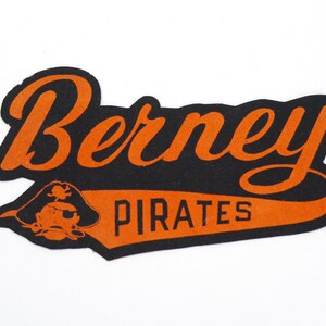 May include: Orange and black felt patch with the text "Berney Pirates" and a cartoon pirate head.