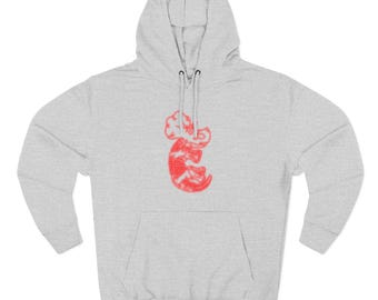 May include: A light gray hoodie with a kangaroo-like design in red. The hoodie features a drawstring hood, long sleeves, and a front pocket. The kangaroo design is centered on the chest.