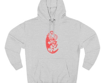 May include: A light gray hooded sweatshirt with a kangaroo pocket and a red embroidered design on the front. The design appears to be a stylized image of a creature. The sweatshirt has a drawstring hood.