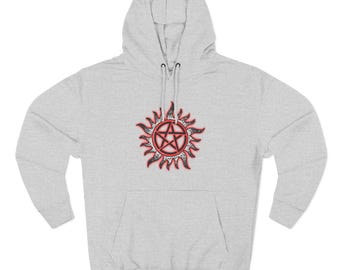 May include: A light gray pullover hoodie featuring a long-sleeved design, a drawstring hood, and a front kangaroo pocket. Centered on the chest is a graphic of a black pentagram enclosed within a stylized sunburst symbol with red outlines.
