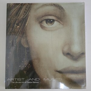 May include: A book titled "Artist and Muses" featuring a close-up portrait of a person's face. The cover art is a sepia-toned image with the title and author's name printed in white.