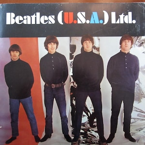 May include: Album cover for "Beatles (U.S.A.) Ltd." featuring the band members in black tops and dark jeans. The album title is in white, with "U.S.A." in red and blue. The background has vertical stripes of red, white, and silver.