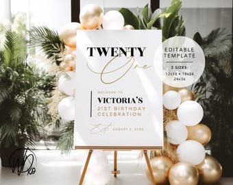 May include: A white sign with black and gold text announcing a 21st birthday celebration for Victoria. The sign reads "Twenty One" in gold script with "Welcome to Victoria's 21st Birthday Celebration" in black text. The date "August 2, 2003" is also included in black text. The sign is on an easel and surrounded by gold and white balloons.