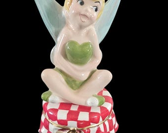 Collectible Disney Tinker Bell salt and pepper shakers, unused.