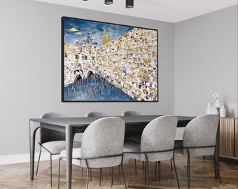 May include: A black framed painting of a stone wall with a blue sky and clouds in the background. The wall is made of large, rough stones and has a gate in the center. The painting is hanging on a gray wall above a black dining table with six gray chairs.