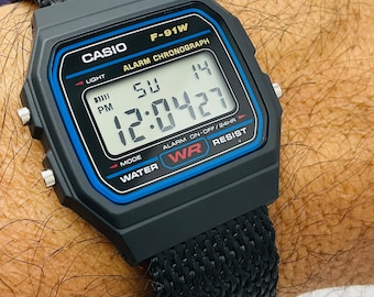 Casio F-91-W-1 watch with Custom Nylon very lightweight Band Water Resistant Alarm Chronograph Digital Watch in Original Box and papers.