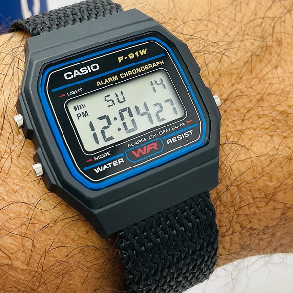 Casio F-91-W-1 watch with Custom Nylon very lightweight Band Water Resistant Alarm Chronograph Digital Watch in Original Box and papers.