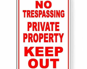 May include: White metal sign with red text that reads "No Trespassing Private Property Keep Out".
