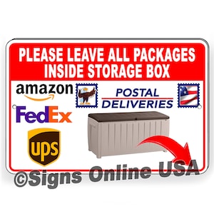 May include: Red and white sign with the text "PLEASE LEAVE ALL PACKAGES INSIDE STORAGE BOX". The sign also includes logos for Amazon, FedEx, UPS, and the United States Postal Service. A gray storage box with a brown lid is pictured with a red arrow pointing to it.