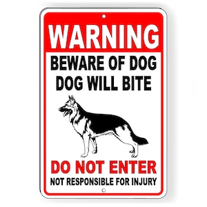 May include: Red and white warning sign with black text and a black silhouette of a German Shepherd dog. The sign reads "Warning Beware of Dog Dog Will Bite Do Not Enter Not Responsible for Injury".