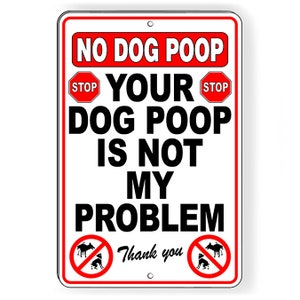 May include: A rectangular white sign with a red border and the text "NO DOG POOP" at the top. The sign reads "YOUR DOG POOP IS NOT MY PROBLEM" in bold black letters. Includes "STOP" signs and a "no dog poop" symbol.