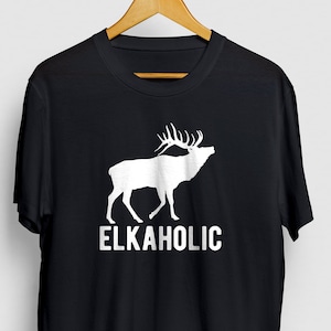 May include: Black t-shirt with a white silhouette of an elk and the text "ELKAHOLIC" printed on the front.