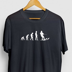 May include: Black t-shirt with a white graphic of the evolution of man, ending with a person water skiing.