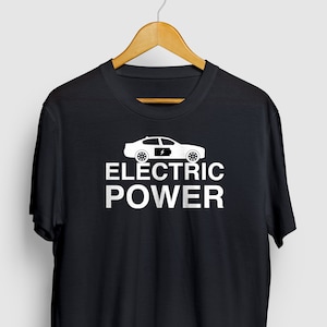 May include: Black t-shirt with a white graphic of an electric car and the text "ELECTRIC POWER".