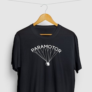 May include: Black t-shirt with a white graphic of a paramotor, the word "PARAMOTOR" is written above the graphic.