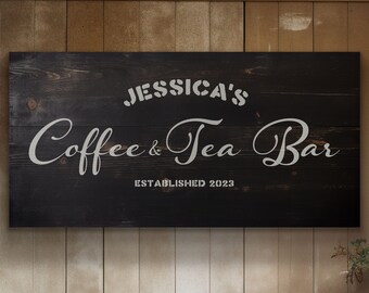 May include: Black wooden sign with white text that reads "Jessica's Coffee & Tea Bar Established 2023".