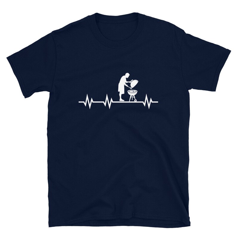 May include: A navy blue t-shirt with a white silhouette of a person grilling and a heartbeat graphic.