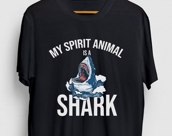 May include: Black t-shirt with a white graphic that says "My spirit animal is a shark" with a cartoon shark illustration.