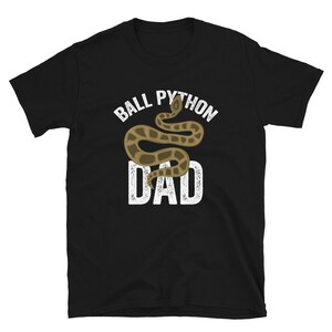 May include: Black t-shirt with white text that reads "Ball Python Dad" and a graphic of a brown ball python.
