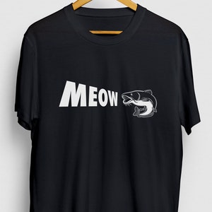 May include: Black t-shirt with a white graphic of a catfish and the word "MEOW" printed on the front.
