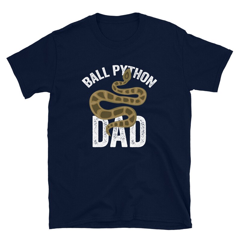 May include: A navy blue t-shirt with a white graphic of a ball python snake and the text "Ball Python Dad".