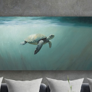 May include: A green sea turtle swims through the water, with a beam of light shining down from above. The turtle is facing to the right of the image.