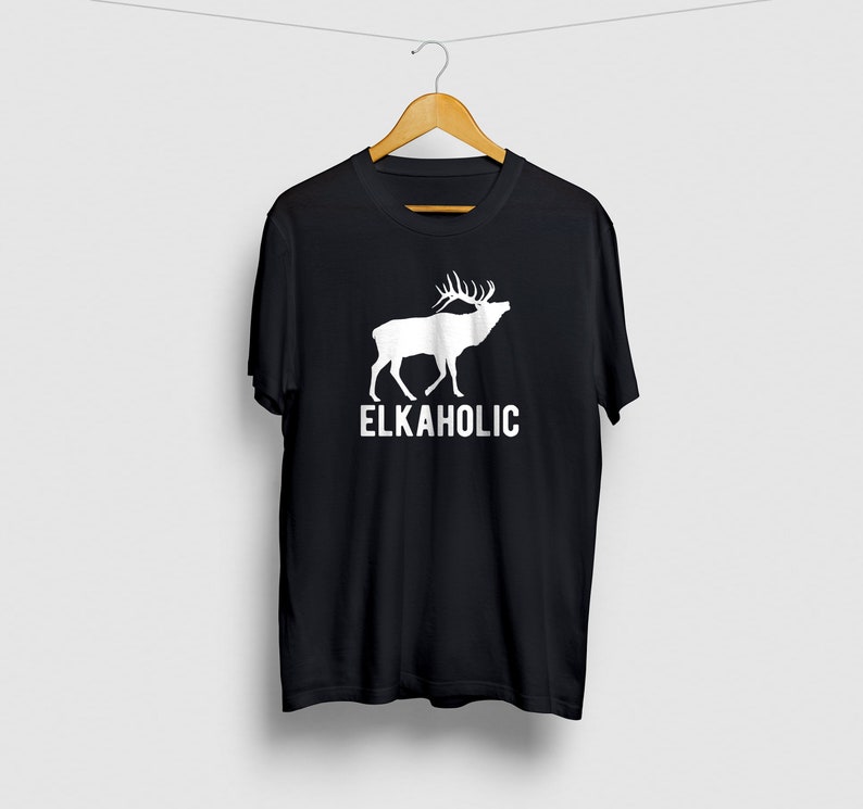 May include: Black t-shirt with a white silhouette of an elk and the text "ELKAHOLIC" printed on the front.