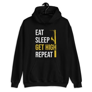 May include: Black hoodie with a white graphic that says "Eat Sleep Get High Repeat" and a silhouette of a person climbing a tree.