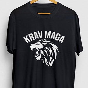May include: Black t-shirt with a white lion graphic and the text "KRAV MAGA" in white.