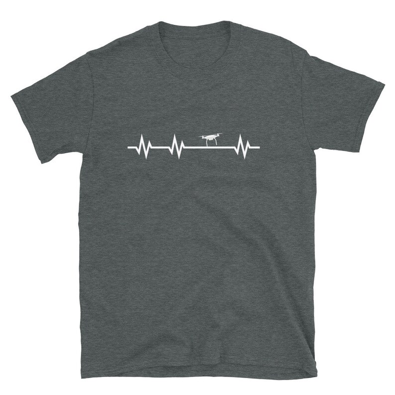 May include: A dark heather grey t-shirt with a white graphic of a drone flying over a heartbeat line.