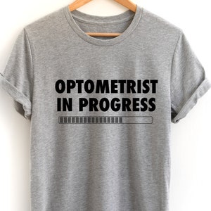 検眼医ギフト、面白い検眼医シャツ、検眼Tシャツ、検眼医シャツ、検眼医進行中Tシャツ