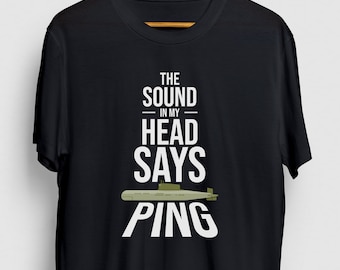May include: Black t-shirt with white text that reads "The sound in my head says ping" and a green submarine graphic.