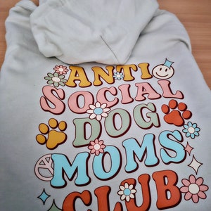 Anti social dog moms club hoodie/sweatshirt/t-shirt perfect for dog moms and their fury friend. Great present for dog walking/lounging image 1