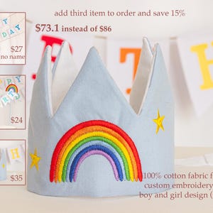 May include: A blue fabric crown with a rainbow and stars embroidered on it. The crown is for a birthday party and is available in boy and girl designs. The text "100% cotton fabric for crown custom embroidery for item boy and girl design (swipe)" is also visible.
