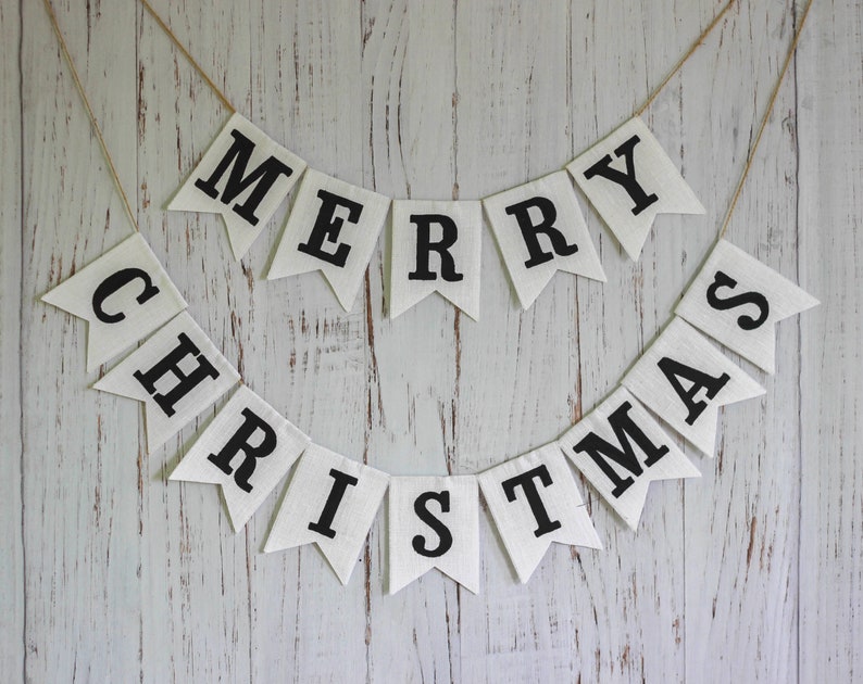 Black and white Merry Christmas fabric banner with alternating flags and matching letters, hanging holiday garland for mantel or fireplace decor.