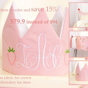 Embroidered name cake topper on pink cotton flags with strawberries on each end. Personalized topper for berry first birthday celebration.