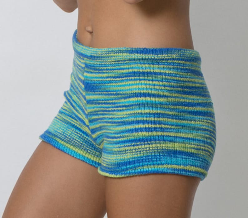 May include: Blue and green striped knit shorts. The shorts are made of a soft, comfortable material and have a relaxed fit.