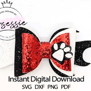 May include: A red, white, and black glitter bow with a white paw print in the center. The bow is designed for crafting and is available for instant digital download in SVG, DXF, PNG, and PDF formats.