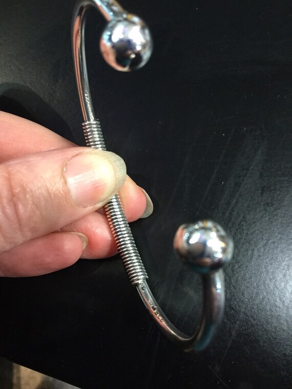 Silver torque bangle with a wire wrap centre - image 6