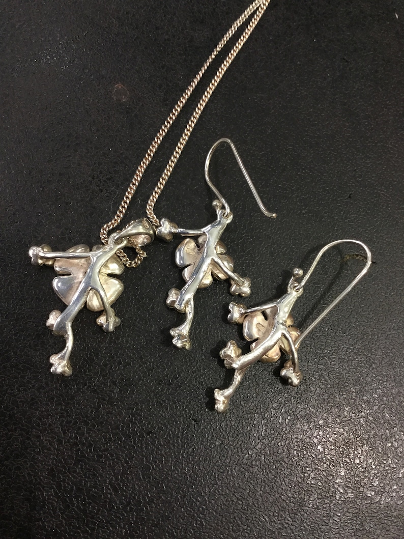 Silver ruby earrings and pendant