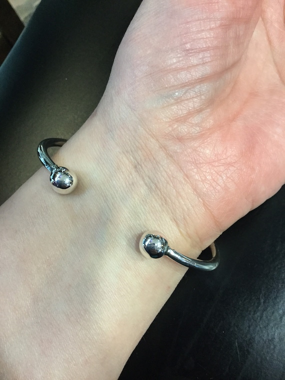 Silver torque bangle with a wire wrap centre - image 4