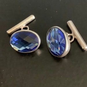 Sterling silver cuff links set with blue glass
