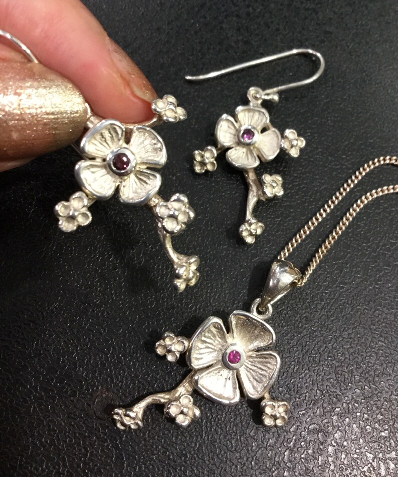 Silver ruby earrings and pendant